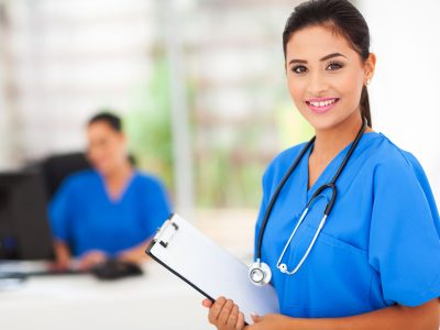 intern nurse holding a clipboard